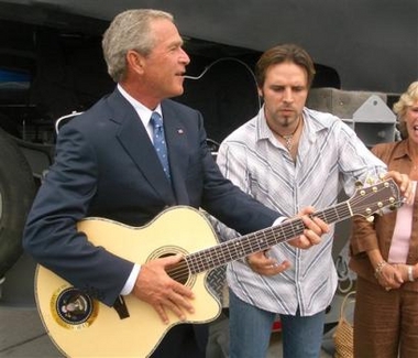 George Bush playing the guitar